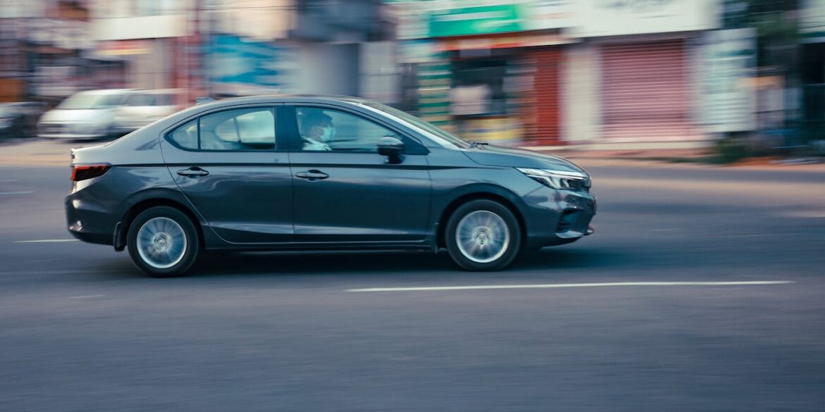 Photo by Ajin K S: https://www.pexels.com/photo/black-sedan-on-the-road-10921166/