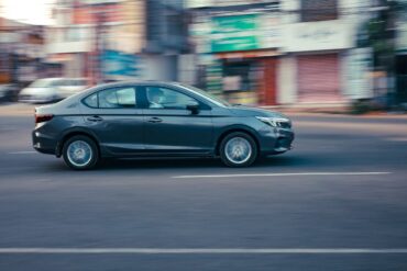 Photo by Ajin K S: https://www.pexels.com/photo/black-sedan-on-the-road-10921166/