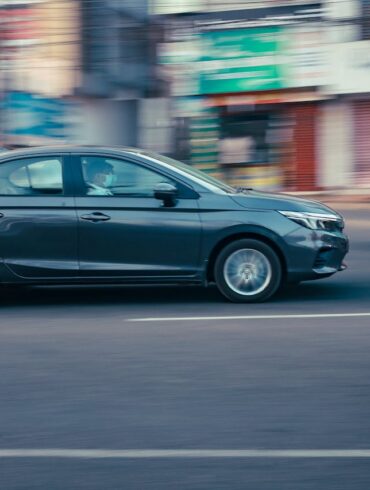 Photo by Ajin K S: https://www.pexels.com/photo/black-sedan-on-the-road-10921166/