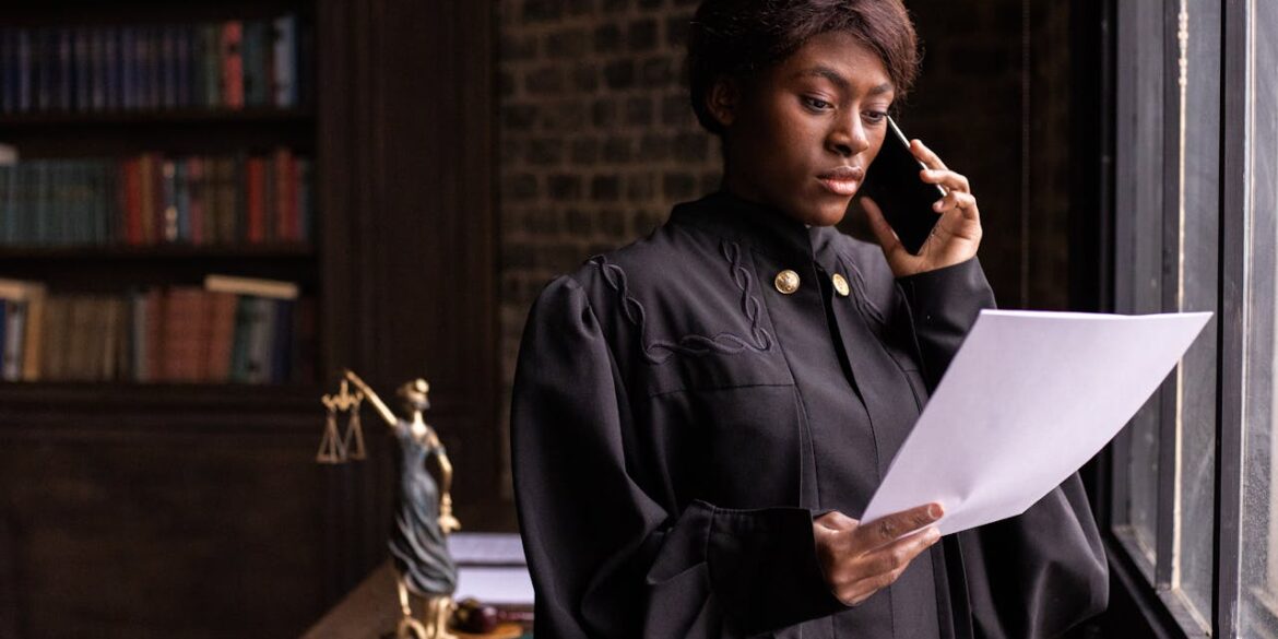 Photo by KATRIN BOLOVTSOVA: https://www.pexels.com/photo/a-judge-reading-a-document-while-having-a-phone-call-6077188/