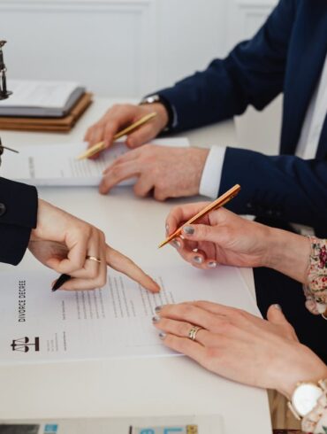 Photo by Photo By: Kaboompics.com: https://www.pexels.com/photo/woman-signing-a-decree-7876038/