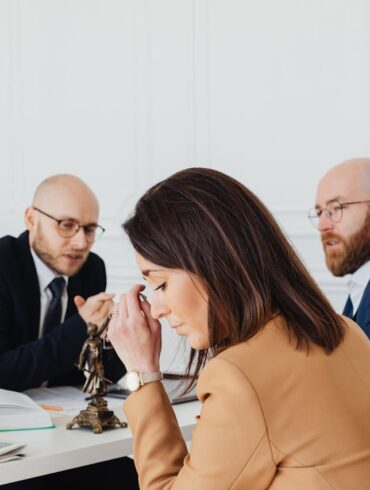 Photo by Photo By: Kaboompics.com: https://www.pexels.com/photo/sad-woman-sitting-next-to-the-bearded-man-7876199/