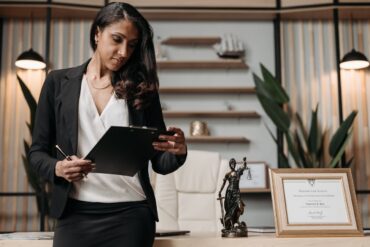Photo by Pavel Danilyuk: https://www.pexels.com/photo/a-woman-in-black-blazer-holding-a-clipboard-8111876/