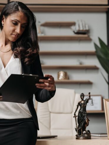 Photo by Pavel Danilyuk: https://www.pexels.com/photo/a-woman-in-black-blazer-holding-a-clipboard-8111876/