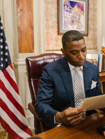 Photo by RDNE Stock project: https://www.pexels.com/photo/a-man-in-suit-while-reading-a-document-7841425/