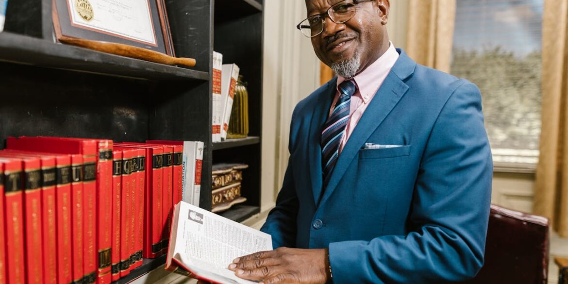 Photo by RDNE Stock project: https://www.pexels.com/photo/a-man-in-blue-suit-jacket-holding-a-book-7841829/