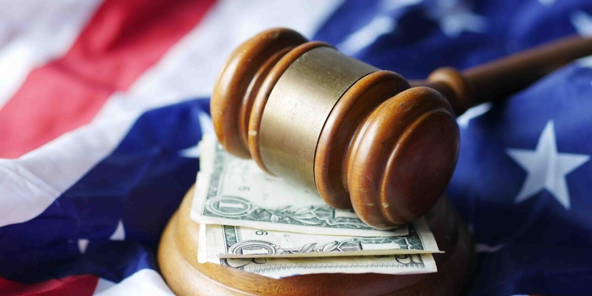 Photo by Towfiqu barbhuiya: https://www.pexels.com/photo/a-mallet-on-top-of-bills-11633645/