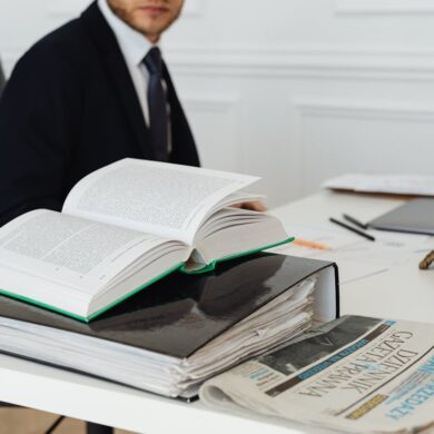 Photo by Photo By: Kaboompics.com: https://www.pexels.com/photo/book-and-binder-on-a-desk-7876088/