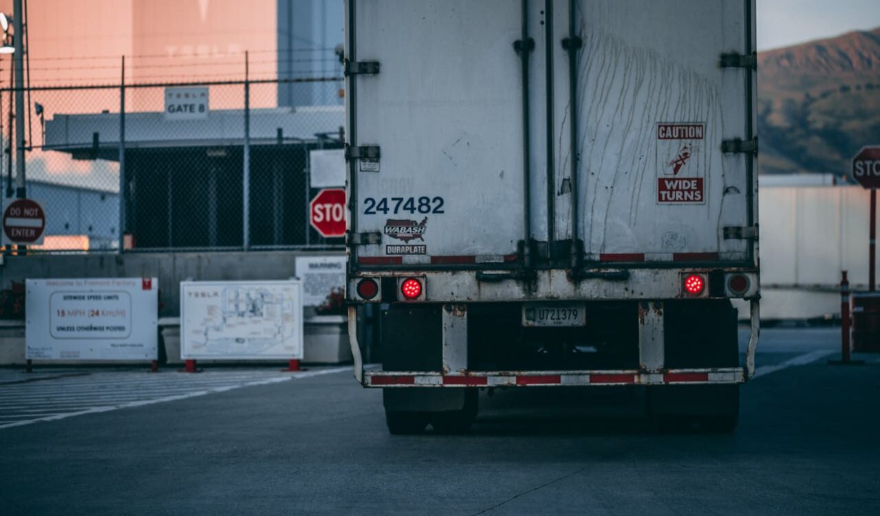 Photo by Craig Adderley: https://www.pexels.com/photo/white-freight-truck-close-up-photography-2449454/