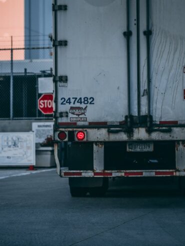 Photo by Craig Adderley: https://www.pexels.com/photo/white-freight-truck-close-up-photography-2449454/