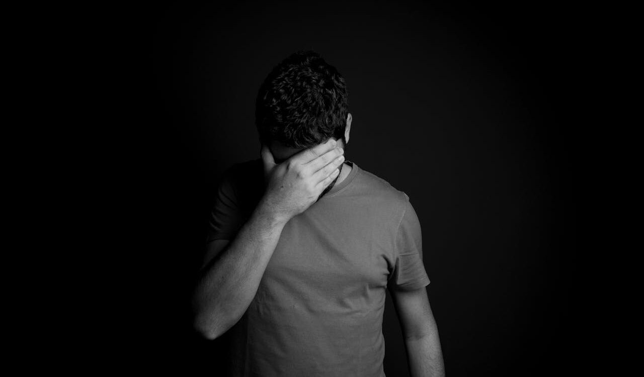 Photo by Daniel Reche: https://www.pexels.com/photo/man-hiding-his-eyes-with-hand-5202004/
