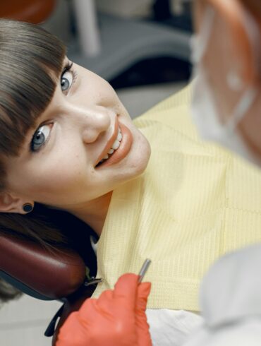 Photo by Gustavo Fring: https://www.pexels.com/photo/portrait-of-woman-in-dentist-chair-4971500/