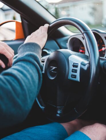 Photo by Erik Mclean: https://www.pexels.com/photo/man-driving-expensive-luxury-car-in-comfortable-interior-5158246/