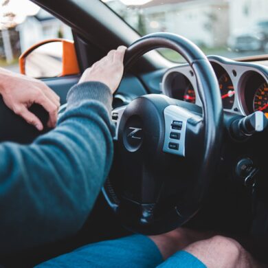 Photo by Erik Mclean: https://www.pexels.com/photo/man-driving-expensive-luxury-car-in-comfortable-interior-5158246/
