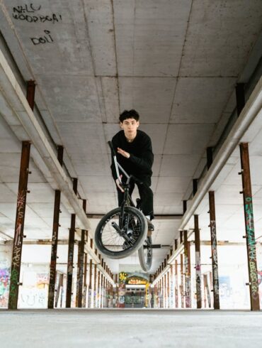 Photo by Tima Miroshnichenko: https://www.pexels.com/photo/a-man-doing-a-trick-with-his-bmx-bike-in-an-abandoned-building-7936432/