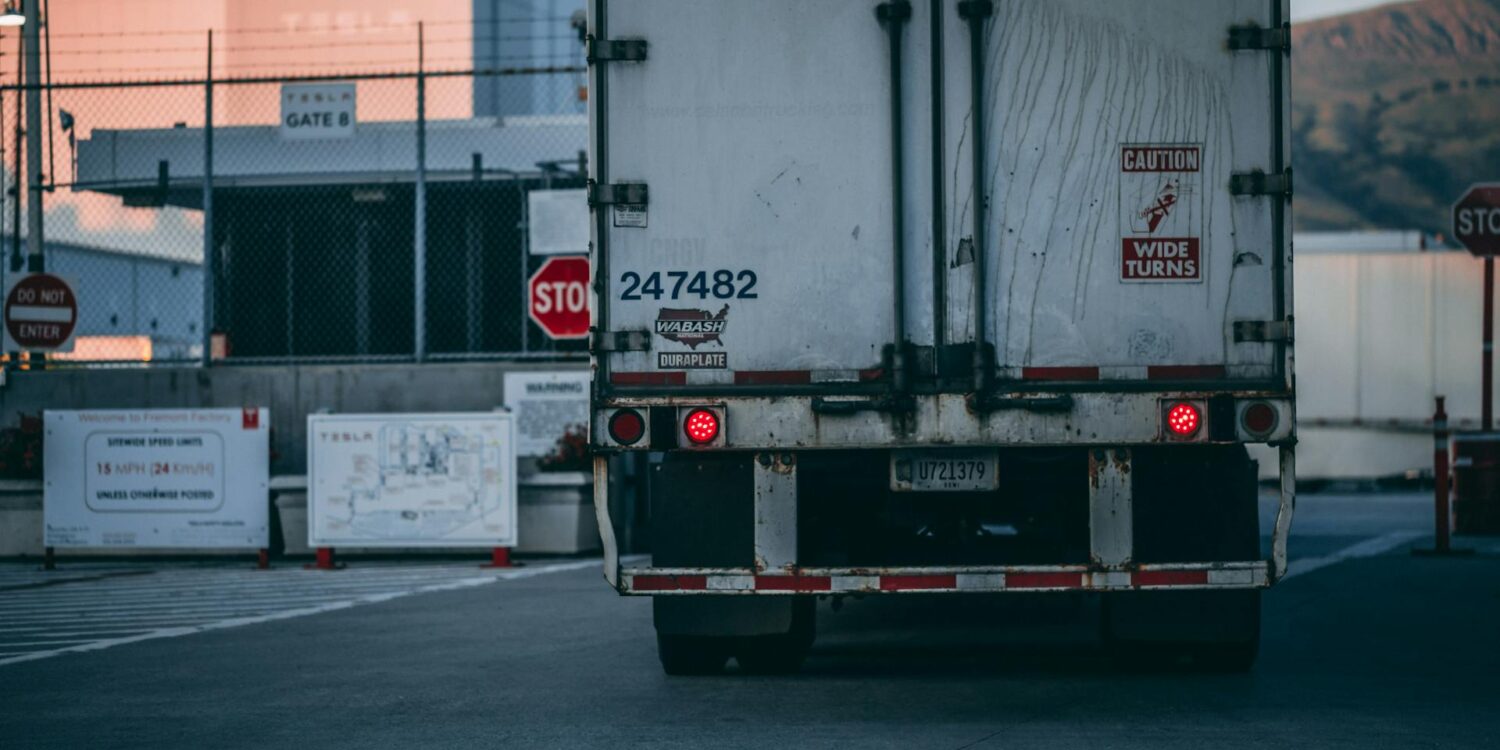 Photo by Craig Adderley: https://www.pexels.com/photo/white-freight-truck-close-up-photography-2449454/