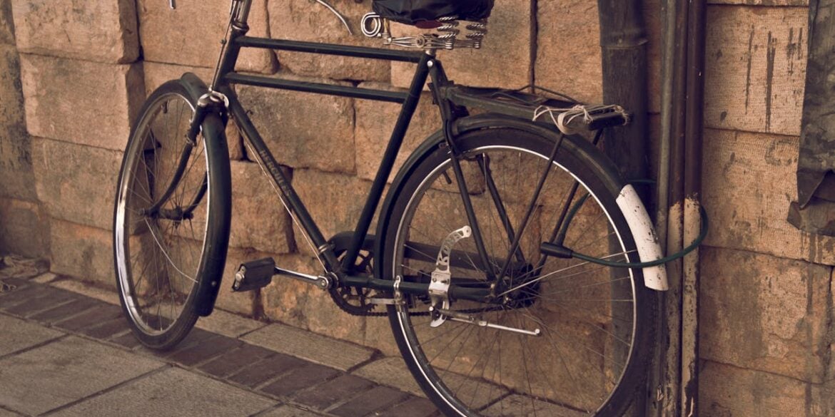 Photo by Fariborz MP: https://www.pexels.com/photo/black-humber-bicycle-parked-beside-a-building-9068563/