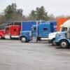 Photo by YL Lew: https://www.pexels.com/photo/colorful-semi-trucks-parked-in-open-lot-35996049/