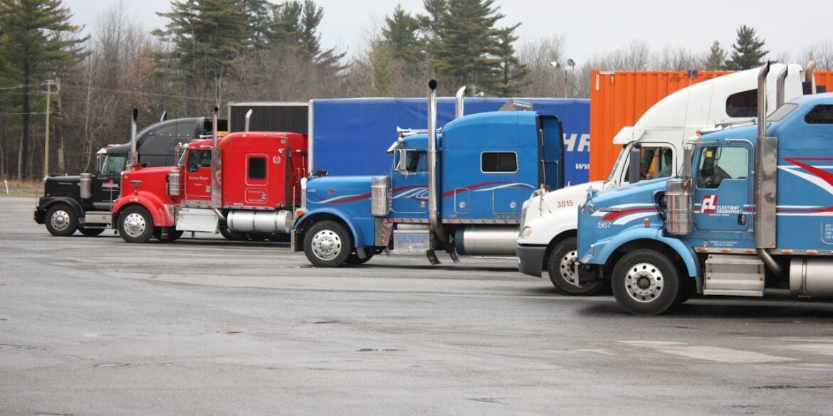 Photo by YL Lew: https://www.pexels.com/photo/colorful-semi-trucks-parked-in-open-lot-35996049/