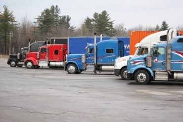 Photo by YL Lew: https://www.pexels.com/photo/colorful-semi-trucks-parked-in-open-lot-35996049/