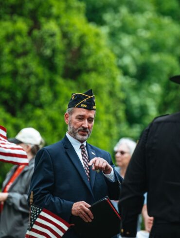 Photo by Chris F: https://www.pexels.com/photo/men-in-suit-and-uniforms-and-with-flags-in-ceremony-26225440/