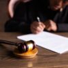 Photo by KATRIN BOLOVTSOVA: https://www.pexels.com/photo/judge-signing-on-the-papers-6077447/