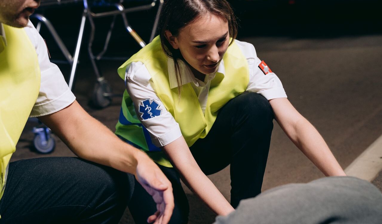 Photo by Mikhail Nilov: https://www.pexels.com/photo/paramedics-helping-the-casualty-lying-on-the-ground-8942736/