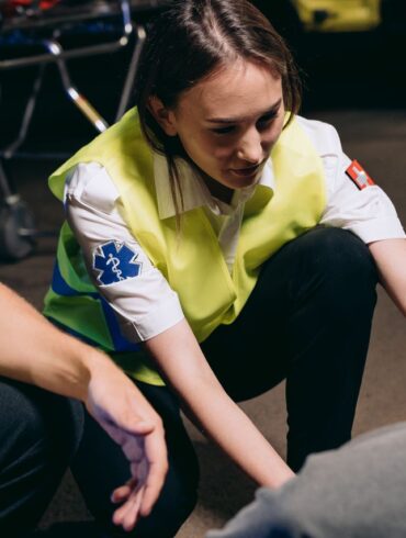 Photo by Mikhail Nilov: https://www.pexels.com/photo/paramedics-helping-the-casualty-lying-on-the-ground-8942736/