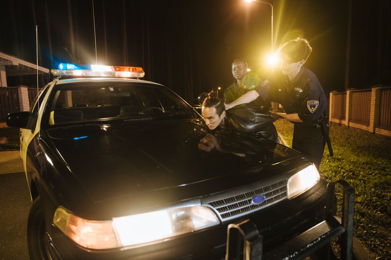 Photo by cottonbro studio: https://www.pexels.com/photo/a-man-being-arrested-by-the-police-10476385/